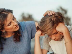 Parent encouraging child after setback