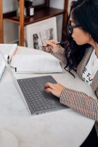 a girl is keeping notes